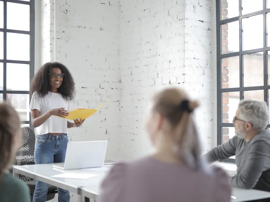 A trainer leading a live session for a small group